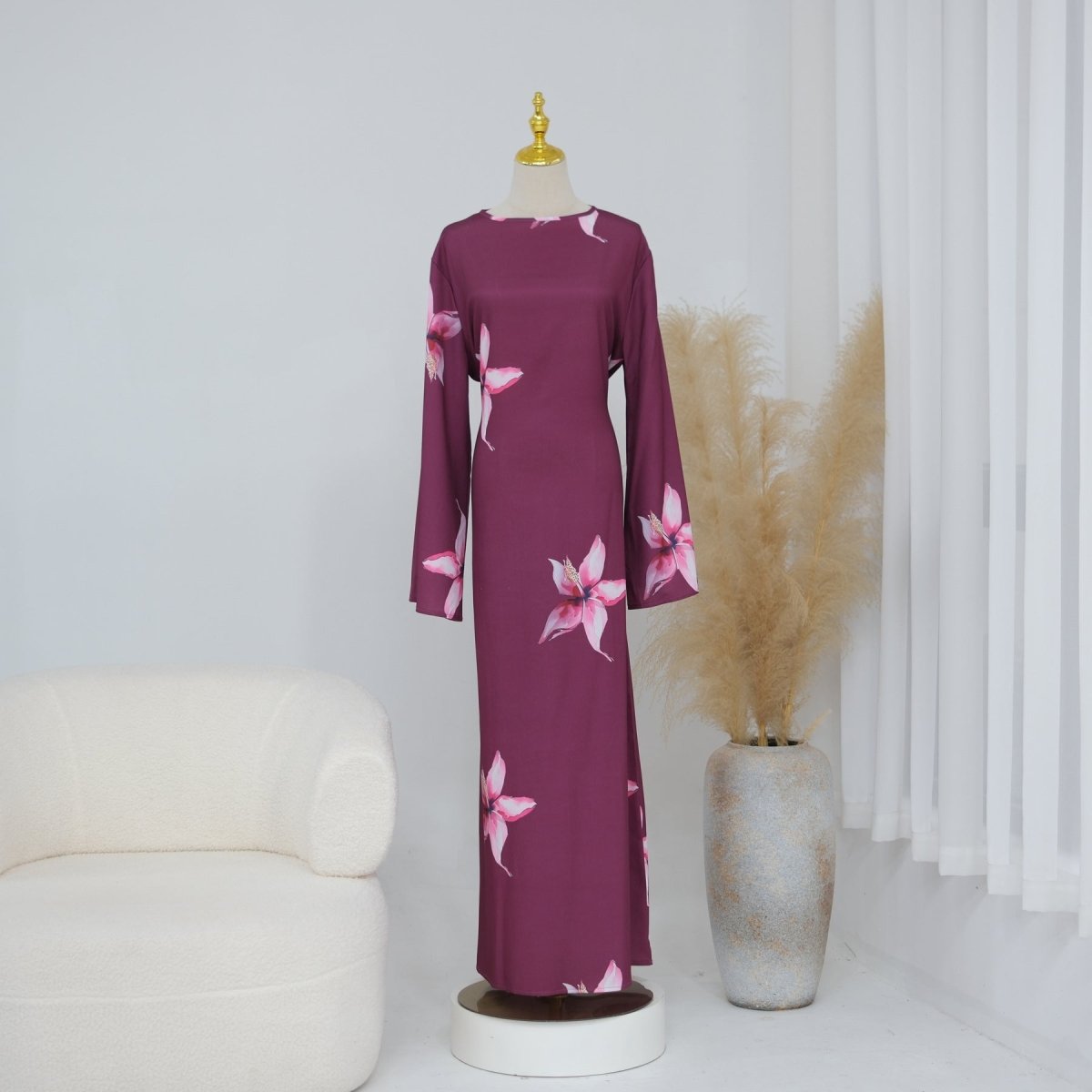 Subtle fabric lustre visible on smooth fluid floral print dress