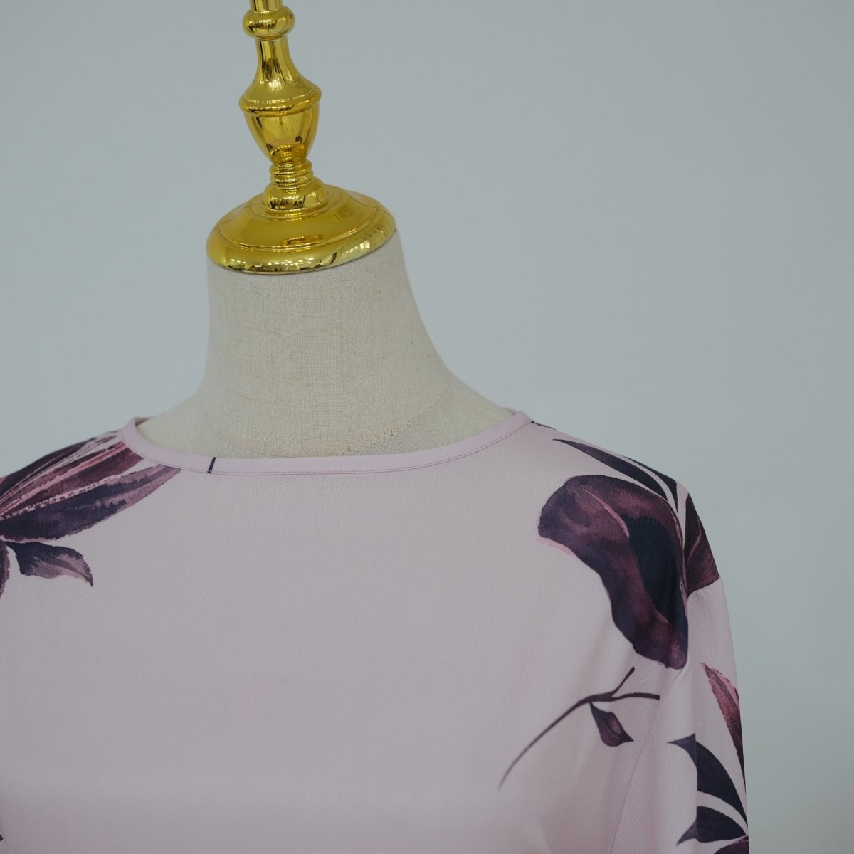 Cape sleeve detail on full-length floral modest dress