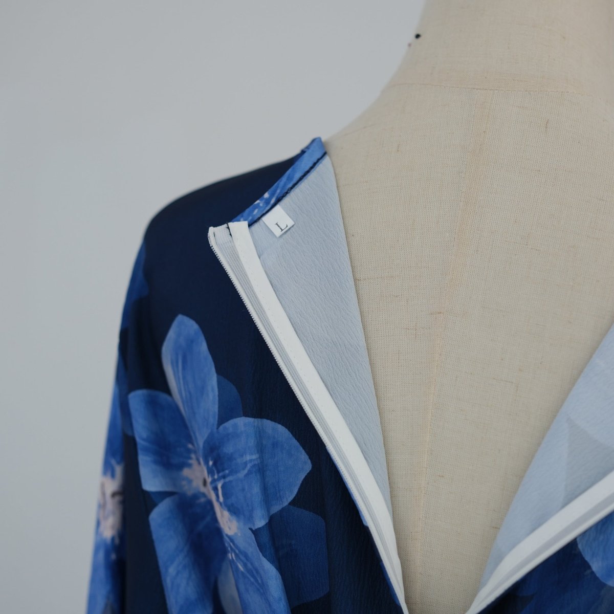 Flat lay of floral maxi abaya with belt