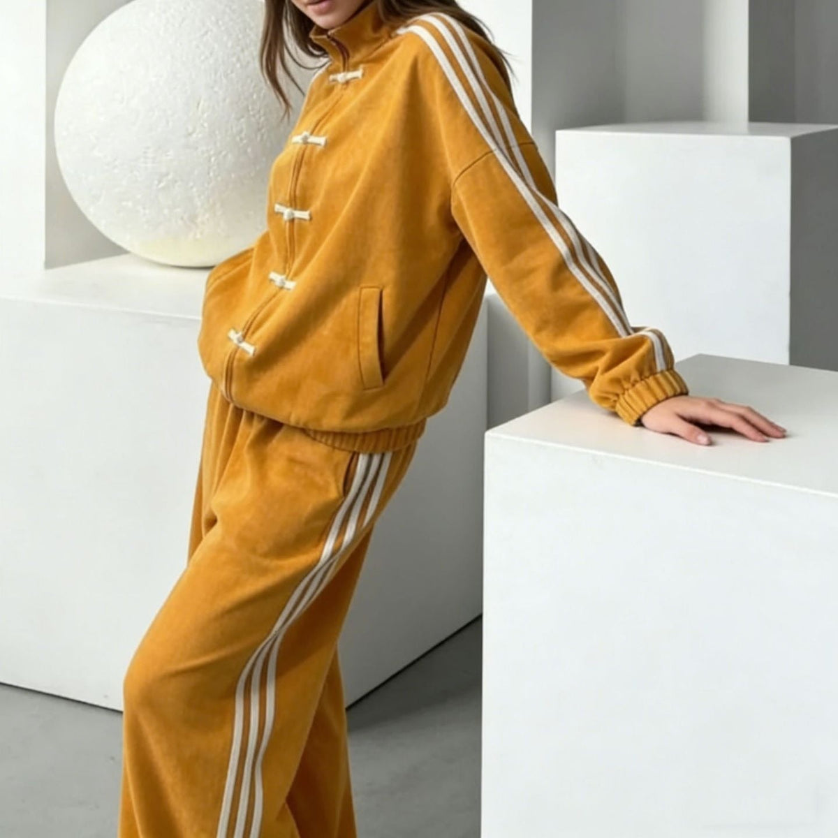 Side stripe trim running down the track pant leg