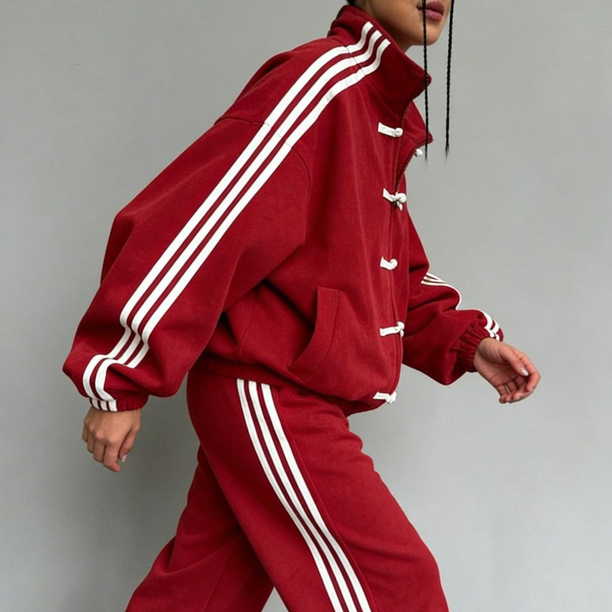 Jacket worn open to show frog-button placket