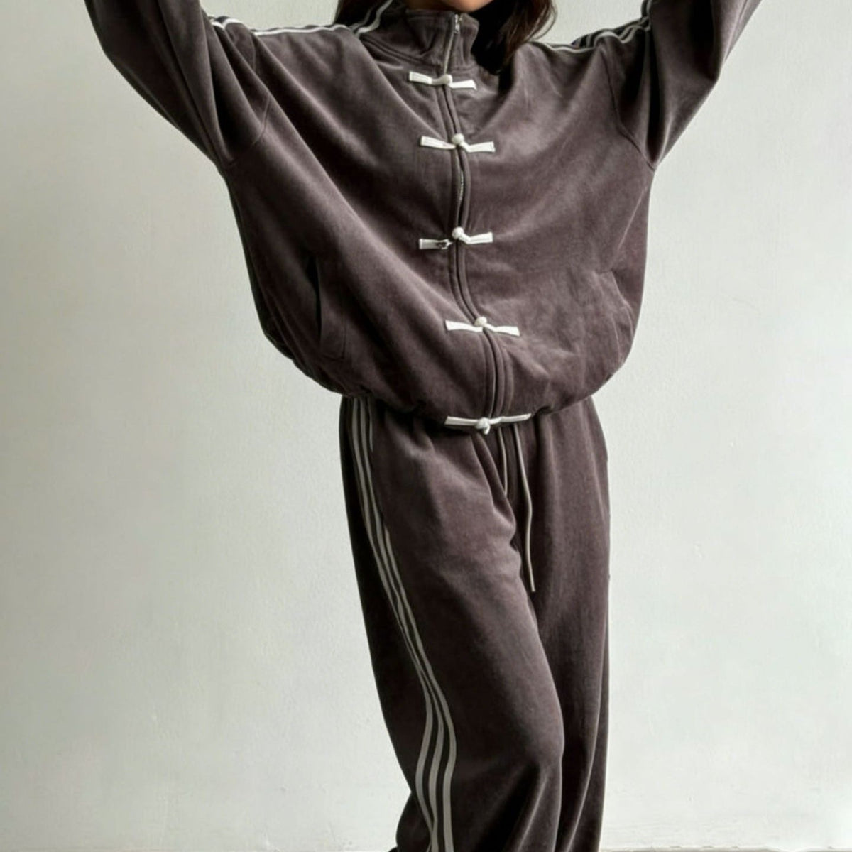 Modest tracksuit styled with trainers for campus days