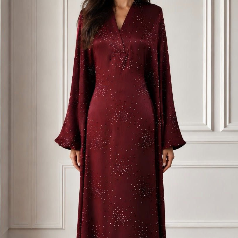 Front view of V-neckline and princess-line seam detail on rhinestone maxi dress