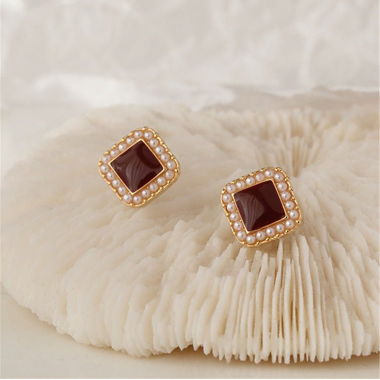 Overhead shot of pearl stud earrings highlighting pearlescent centre accent