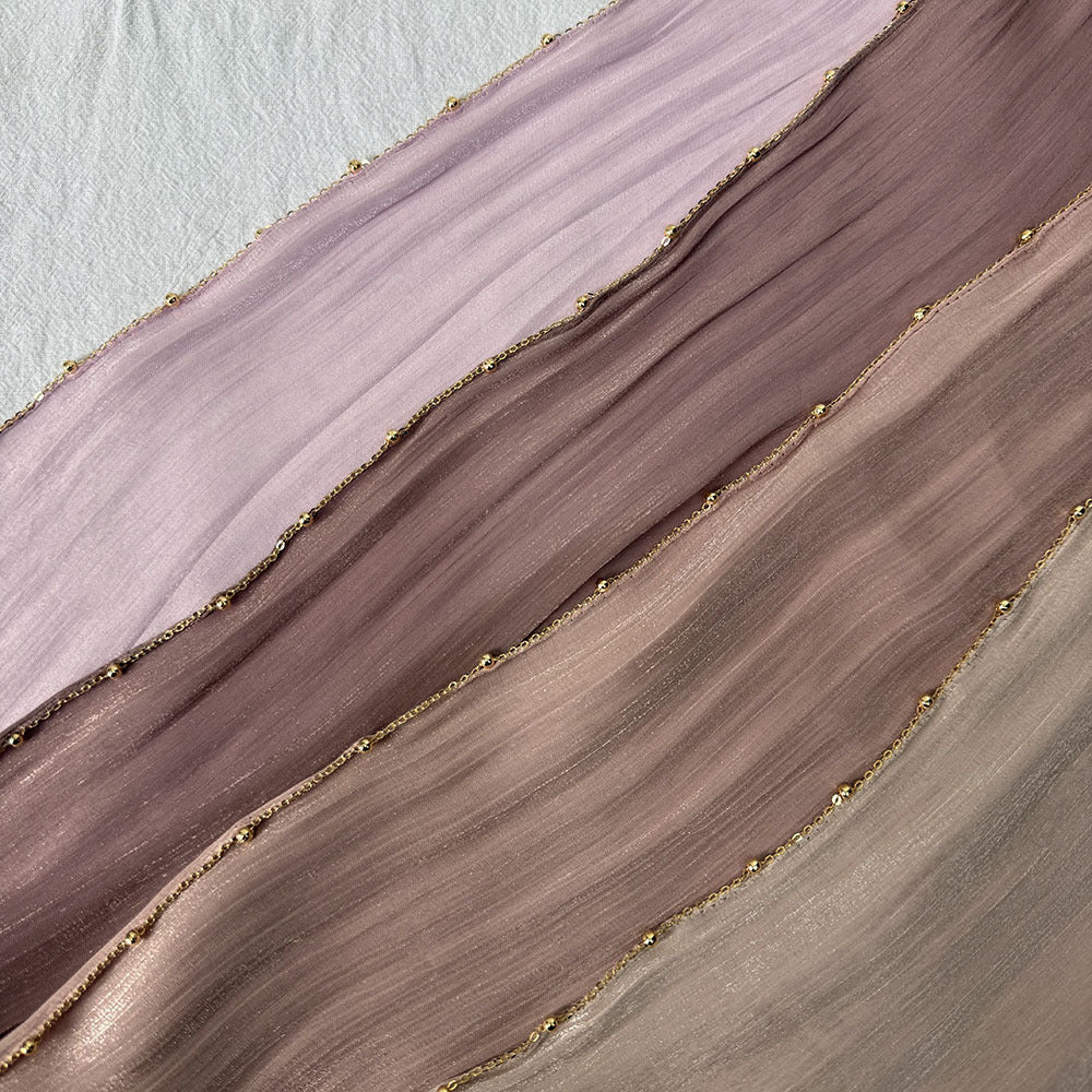 Close-up of gold chain and bead edge trim on crinkle satin hijab