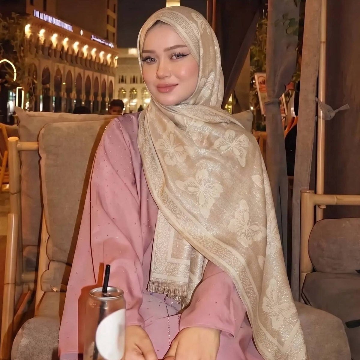 Gold-thread hijab paired with plain modest abaya outfit