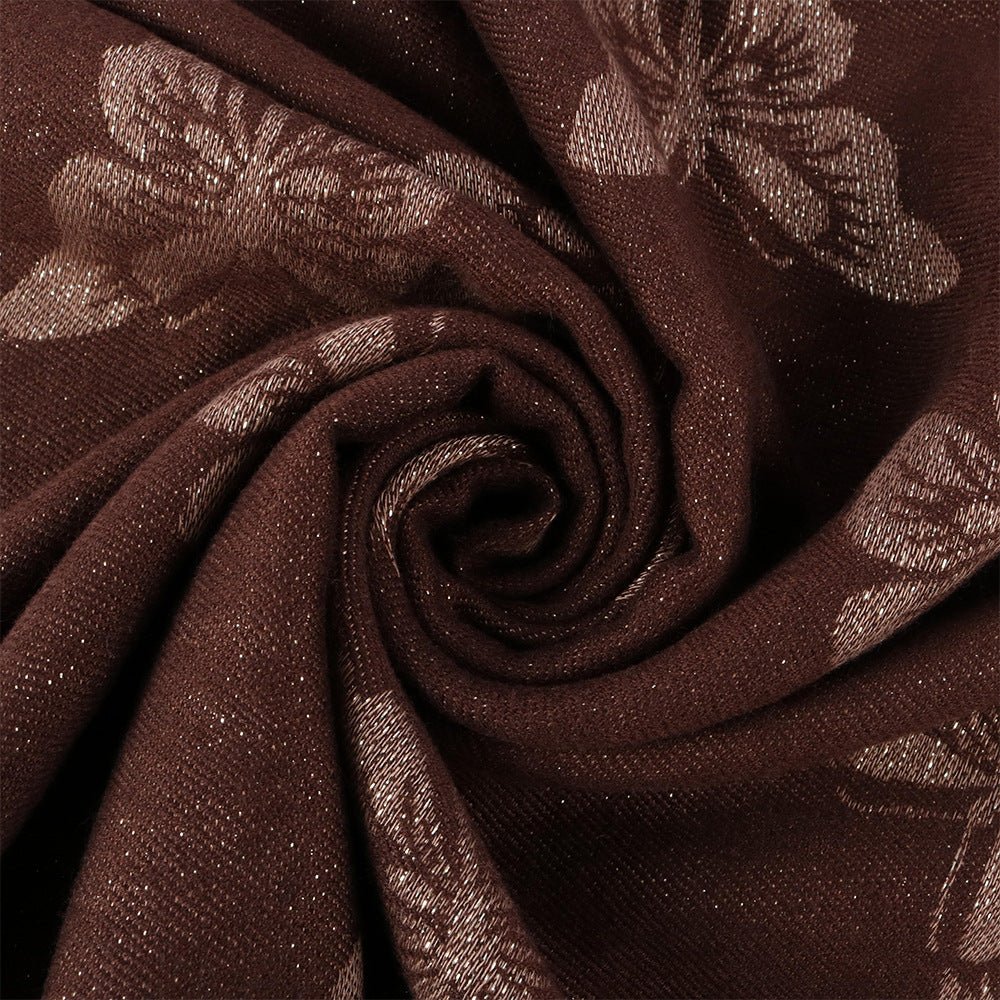 Close-up of gold-thread jacquard woven pattern on hijab