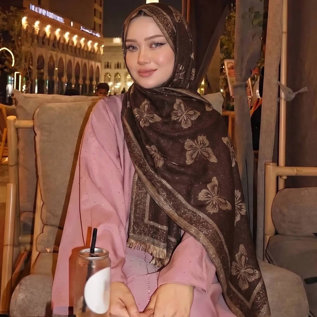 Gold jacquard hijab styled as a neck scarf with modest dress