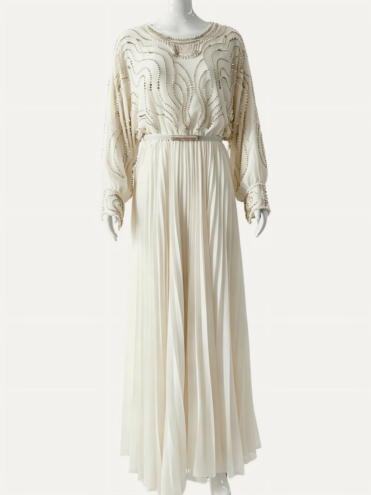 Side profile of handbeaded batwing maxi dress showing sleeve drape and pleat column