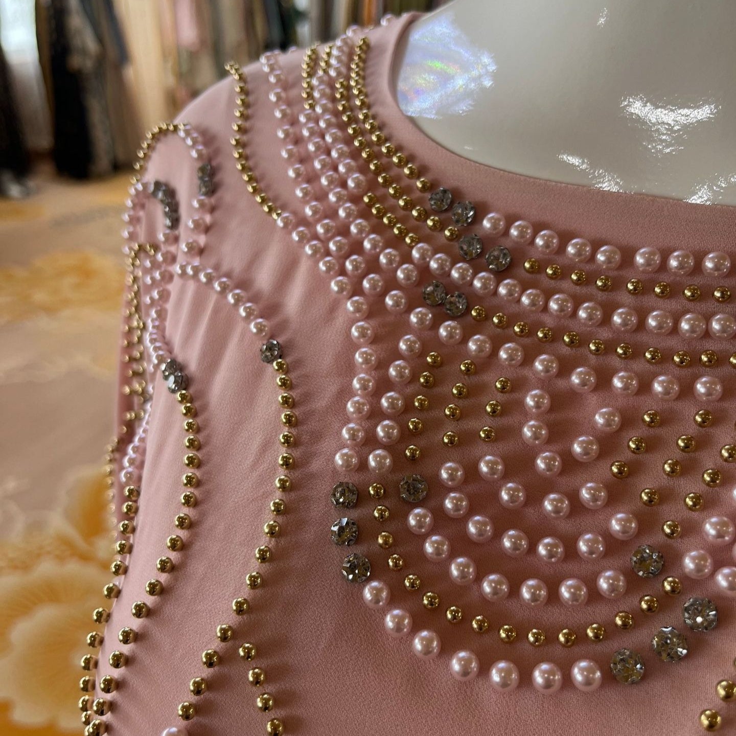Back keyhole closure with rose gold cabochon buttons on pearl crystal maxi dress