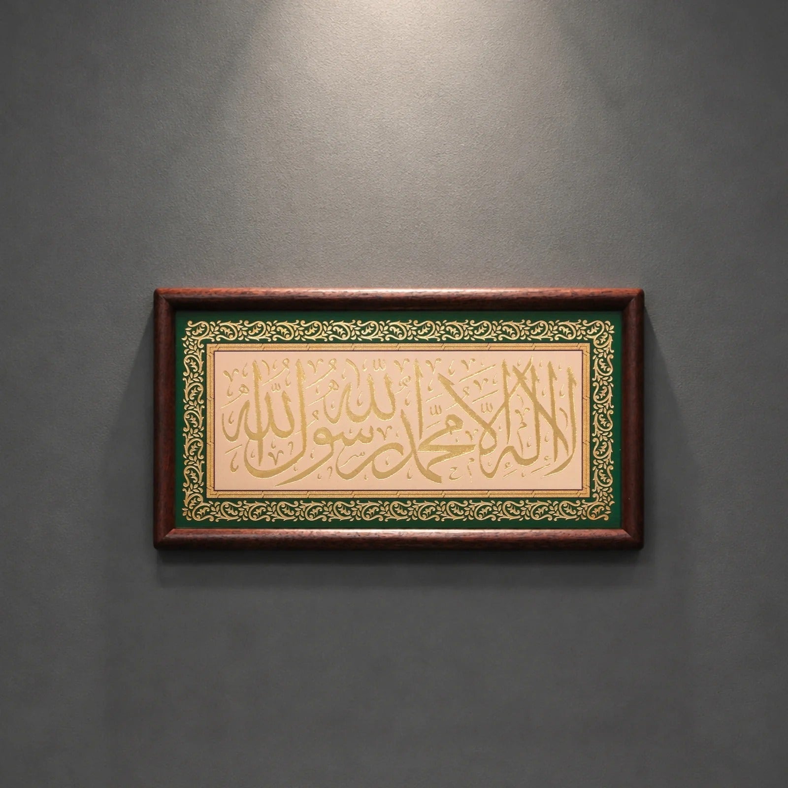 Framed Islamic wall decor displayed on a shelf