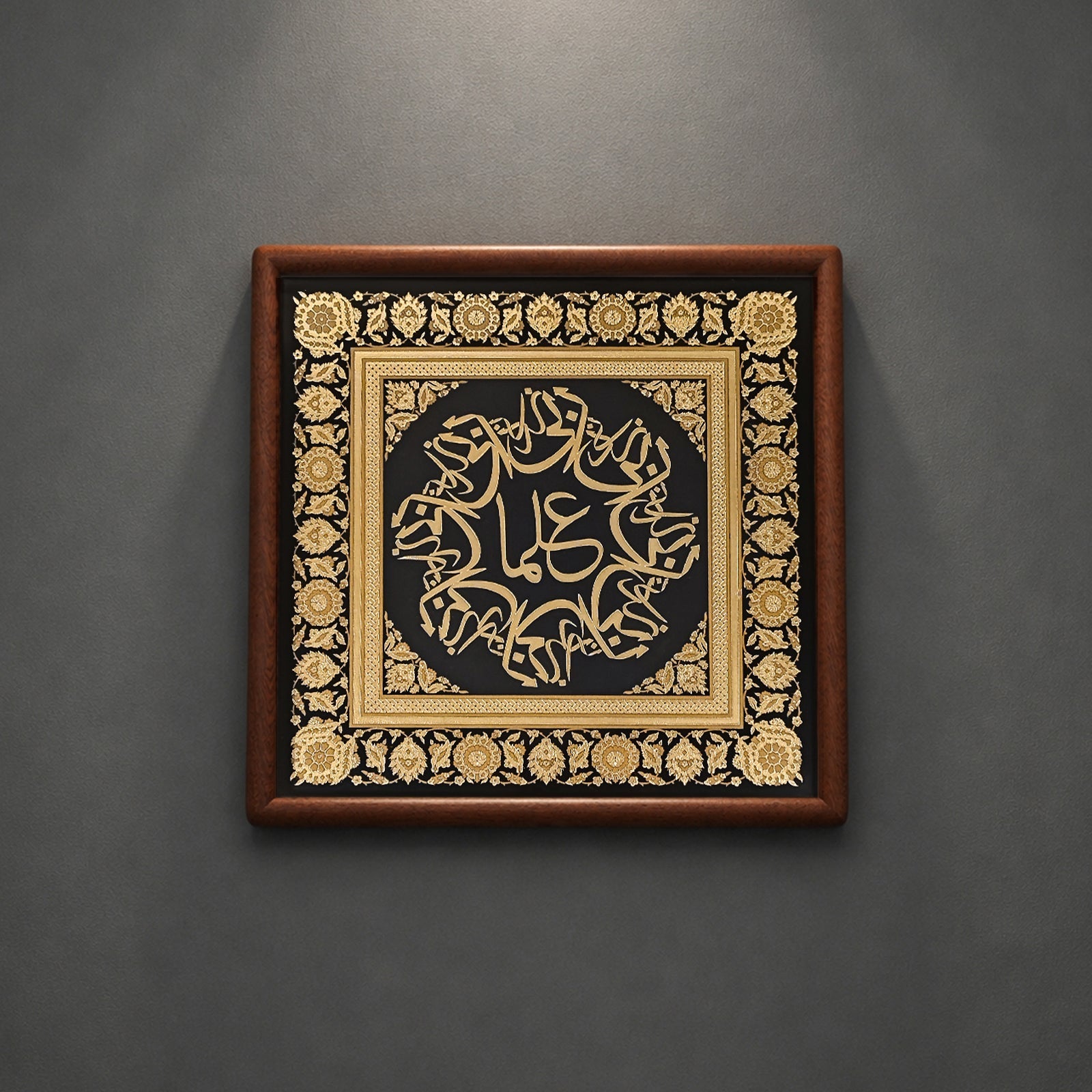 Tabletop display of copper relief Islamic art on office desk
