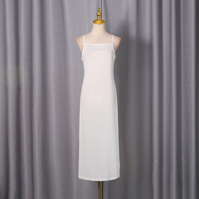 Back view showing high mock neck tie closure on white ruffle dress