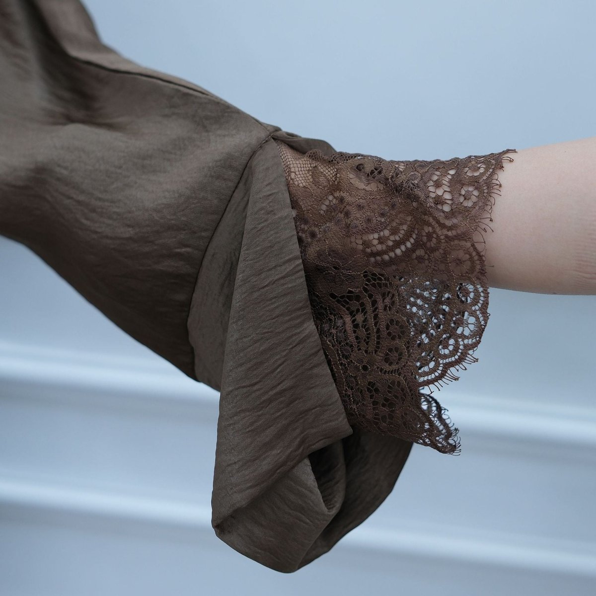 Full-length view of open abaya worn unbelted for flowing shape
