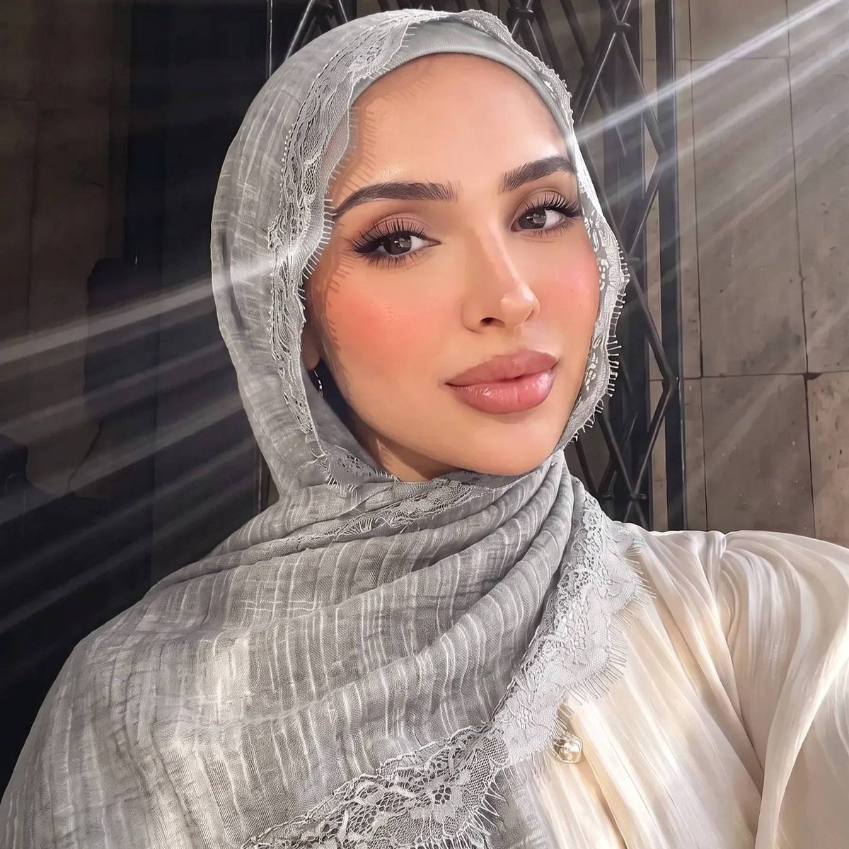 Fabric drape detail of the lightweight lace hijab