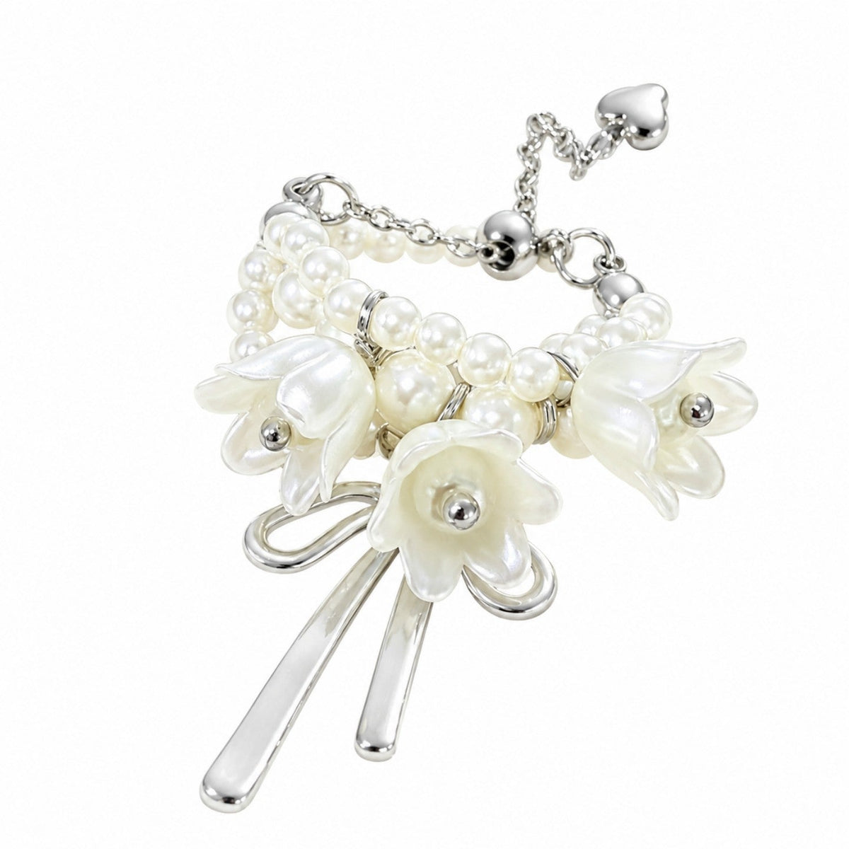 Close-up of faux pearl accents and ribbon tassel on adjustable floral ring