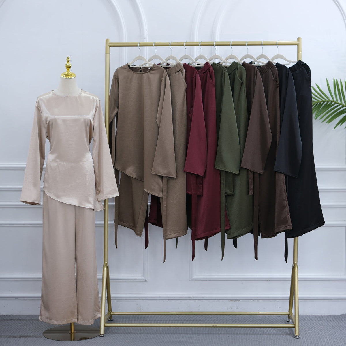 Asymmetric diagonal hem detail on lustrous satin-feel top