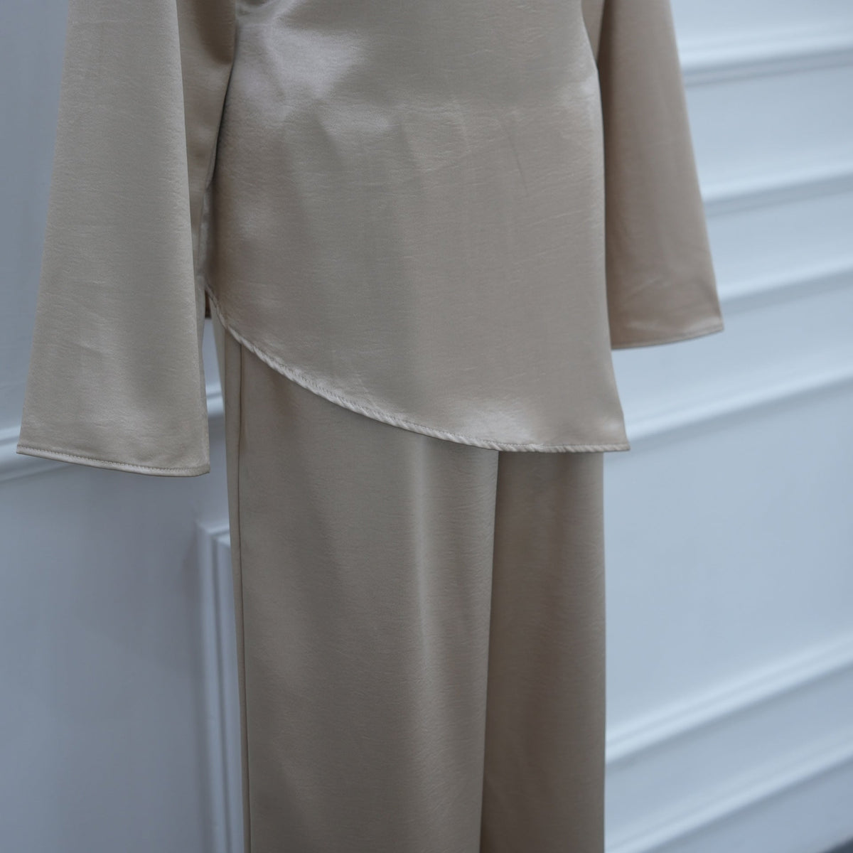 Back keyhole button detail at neckline of satin top