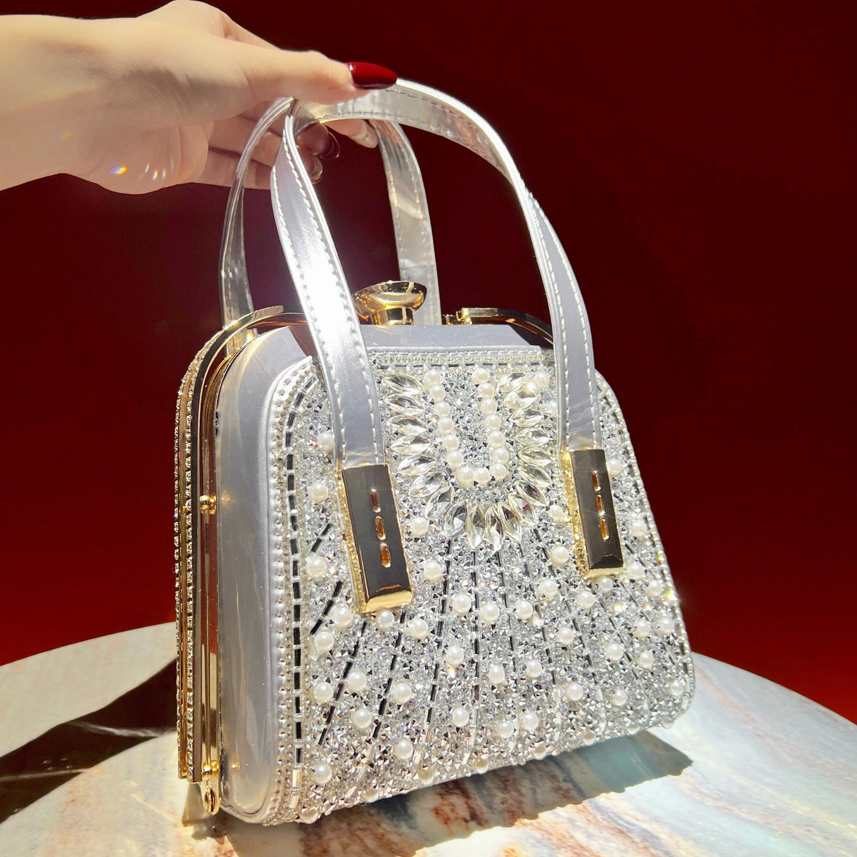 Open interior of pearl crossbody clutch bag showing polyester lining and metal clasp lock