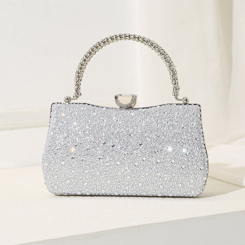Side profile of rhinestone evening clutch showing depth and frame structure