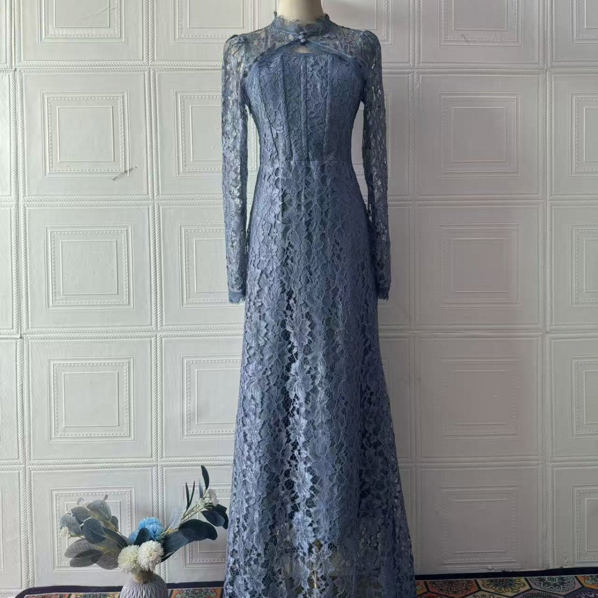 Fitted tailored silhouette of floral lace gown flowing to the floor