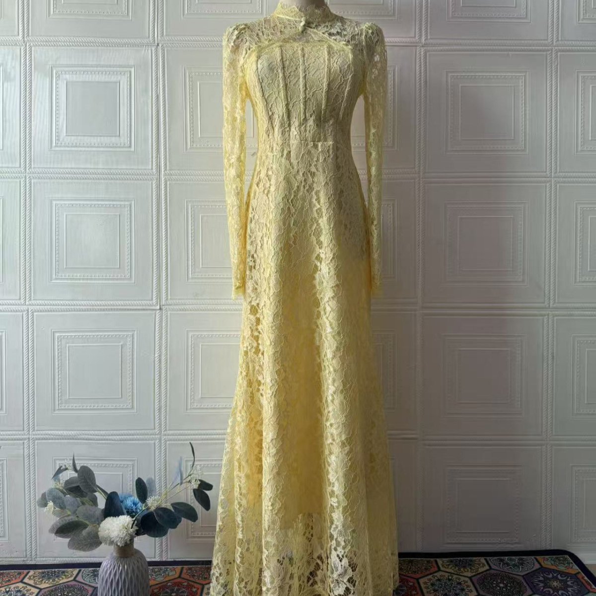 Back view showing corset lace-up ribbon detail on luxury lace dress