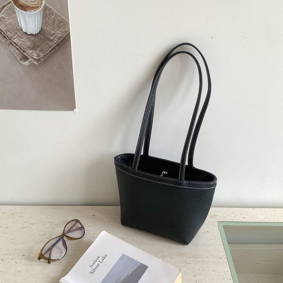 Side profile of structured tapered bucket tote bag