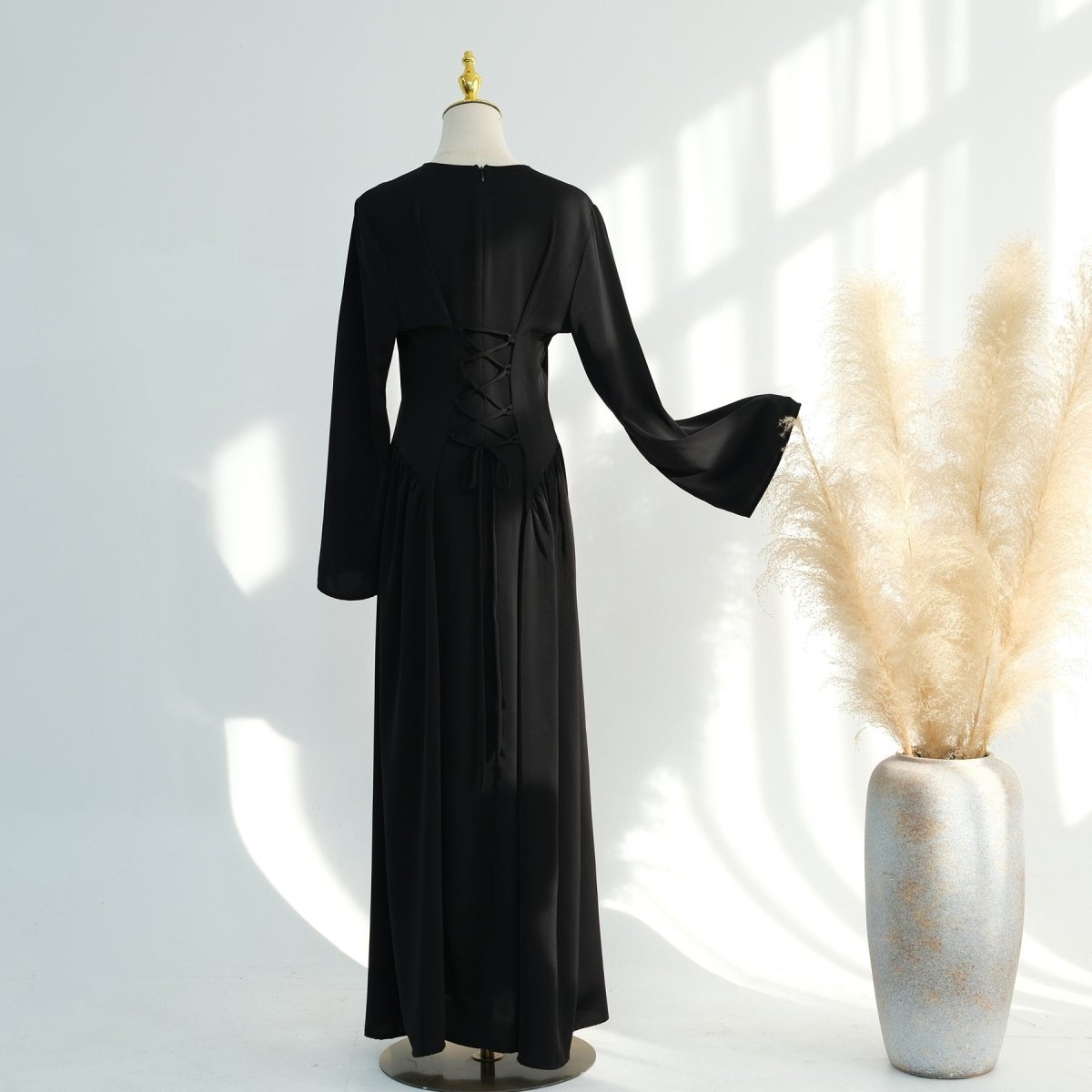 Full-length side view of nida flared maxi dress with graceful A-line hem