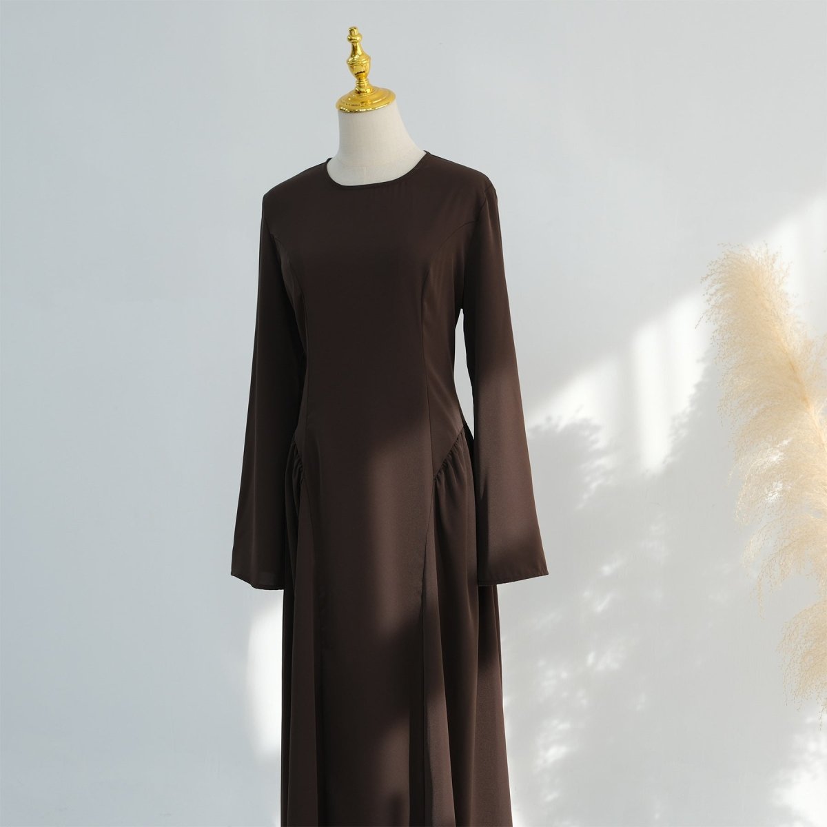 Structured fitted bodice with princess seams on modest nida dress