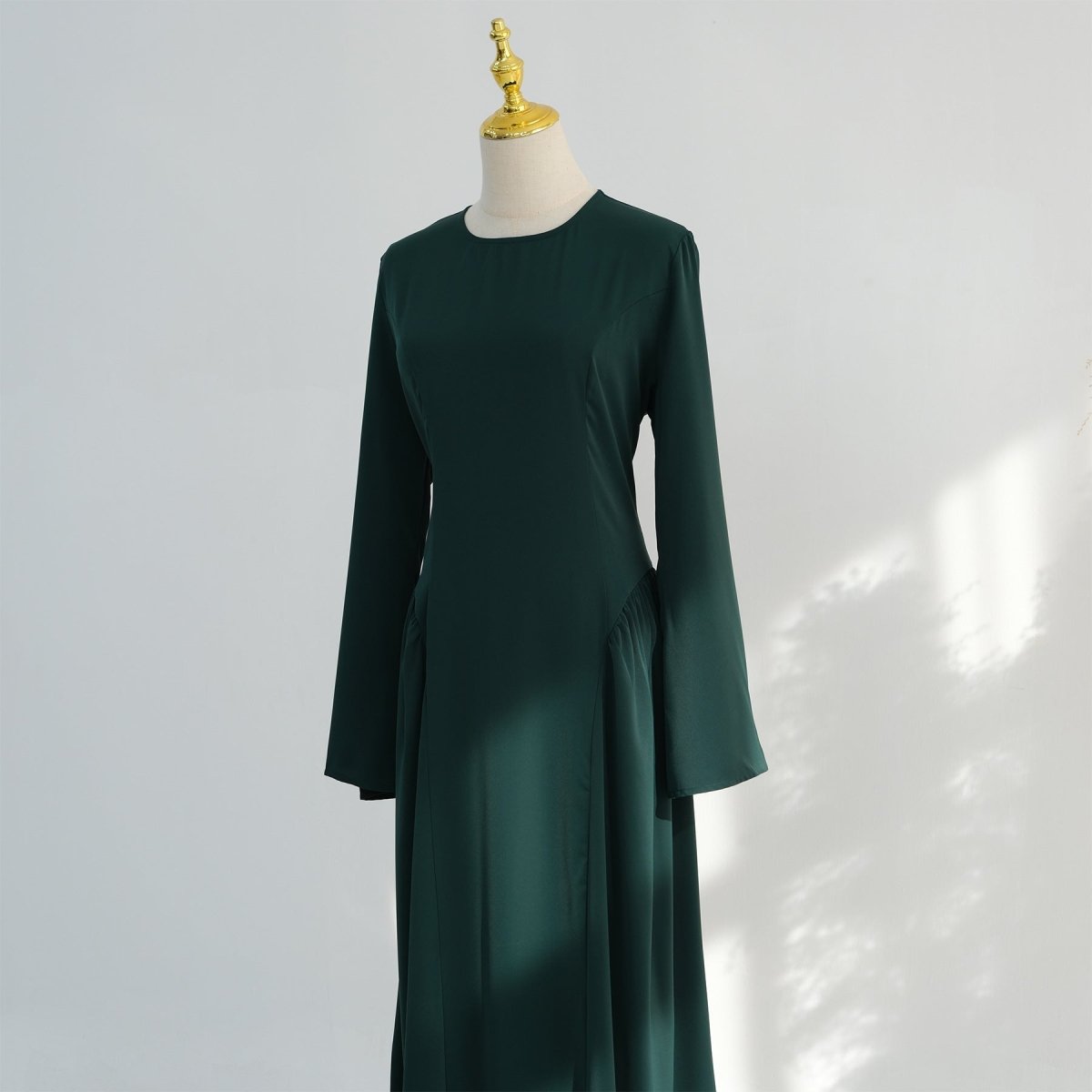 Graceful movement of bell sleeves on nida abaya dress in motion