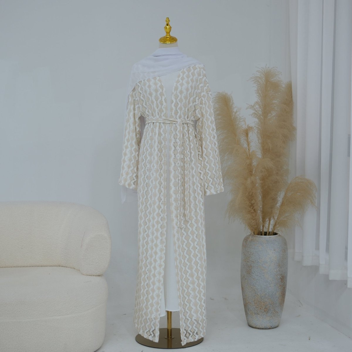 Front view of openwork lace knit abaya showing V-neckline open front