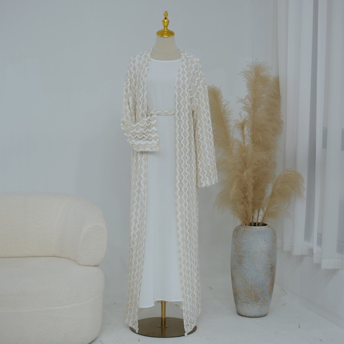 Self-tie belt at waist on openwork lace abaya