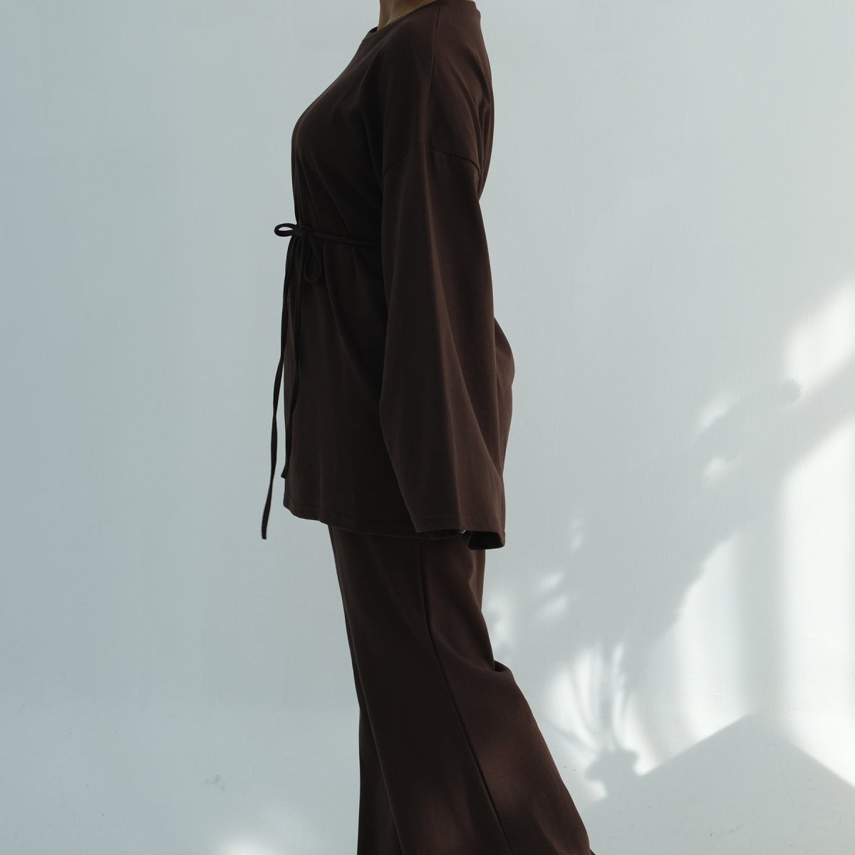 Close-up of deep side pocket on wide-leg cotton trousers