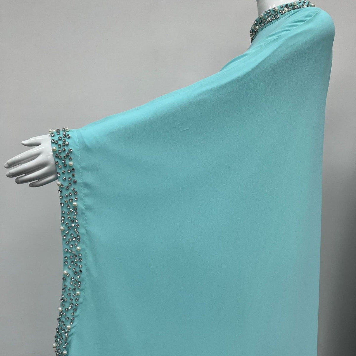 Back view of batwing sleeve maxi abaya showing keyhole neck opening and sweeping hem