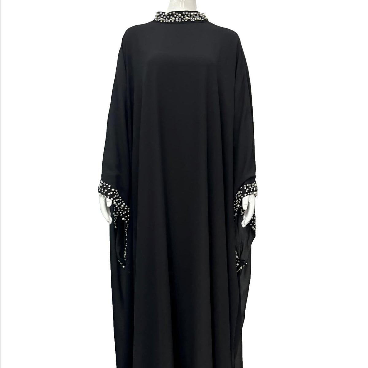 Full hem sweep of lightweight fluid maxi abaya dress at floor length