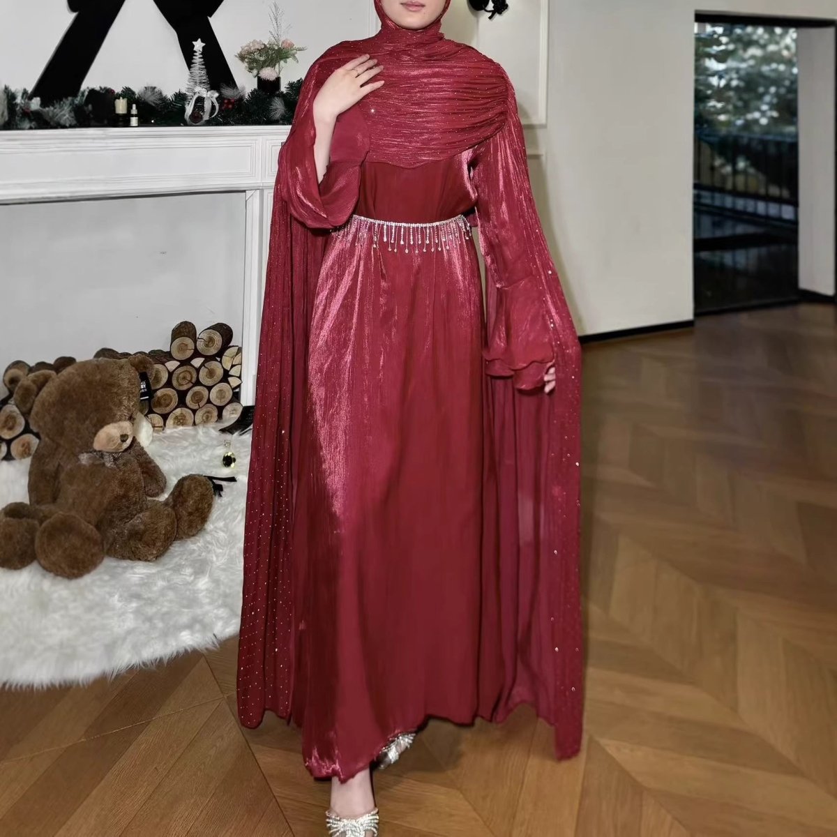 Floor-length hem detail of rhinestone silk maxi abaya