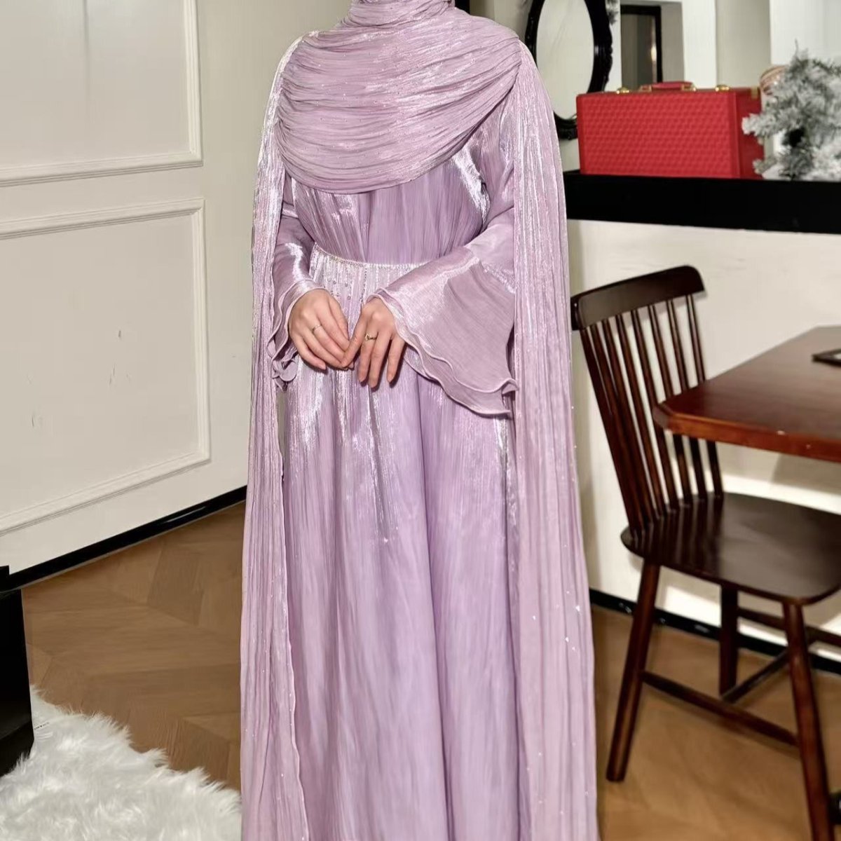 Pleated abaya in fifth colourway showing deep jewel-toned finish