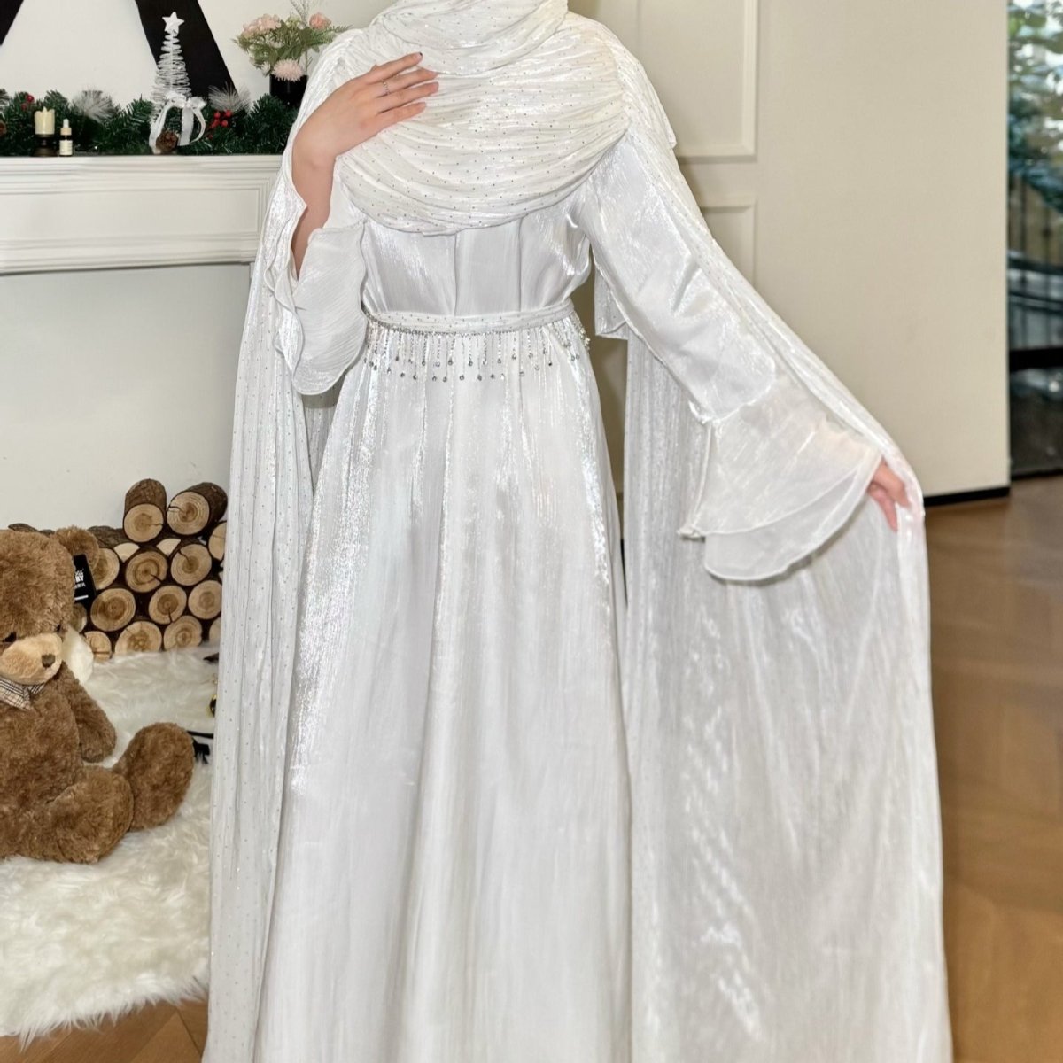 Pleated cape sleeve abaya in third colourway against neutral background