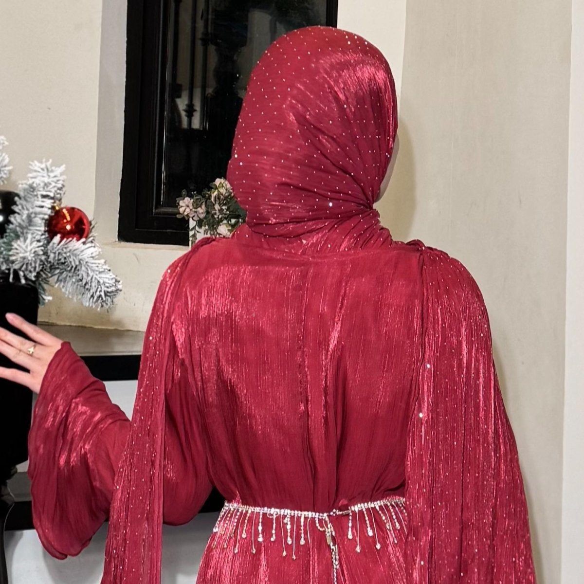 Close-up of all-over natural pleating texture on island silk abaya