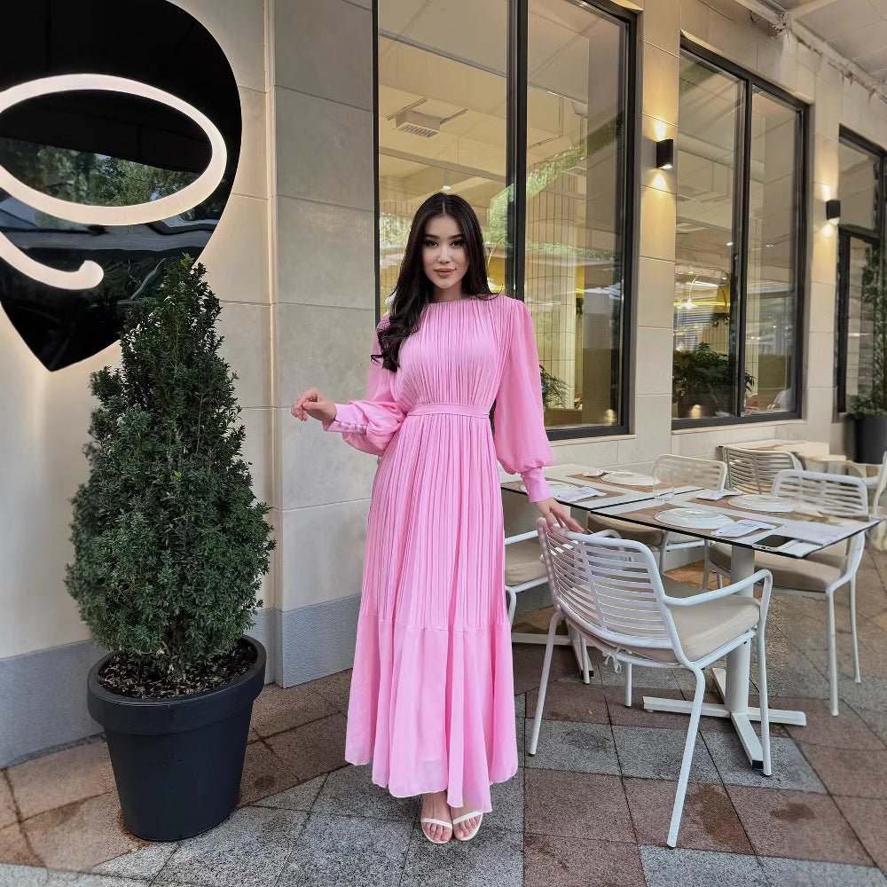 Front view of pleated tiered maxi dress showing vertical pleat detail