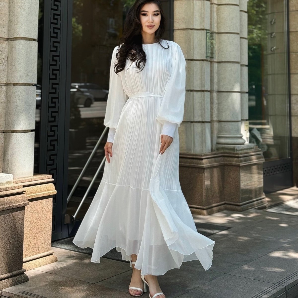 Flowing hem of tiered swing maxi dress in lightweight fluid fabric