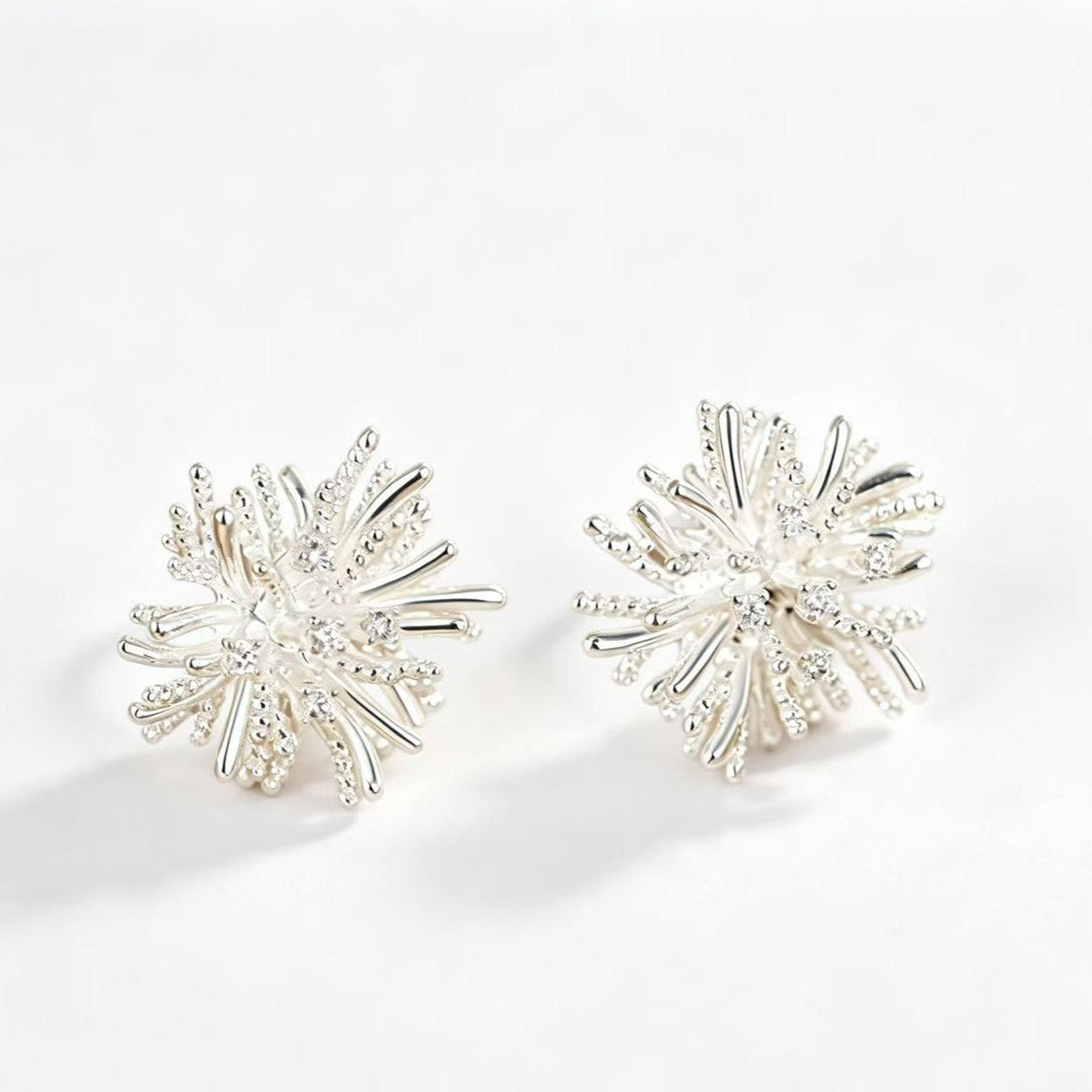 Side profile showing 3D starburst silhouette depth and sparkle