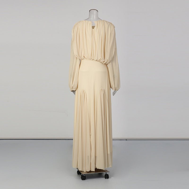 Wide sweeping pleated skirt flowing to floor length