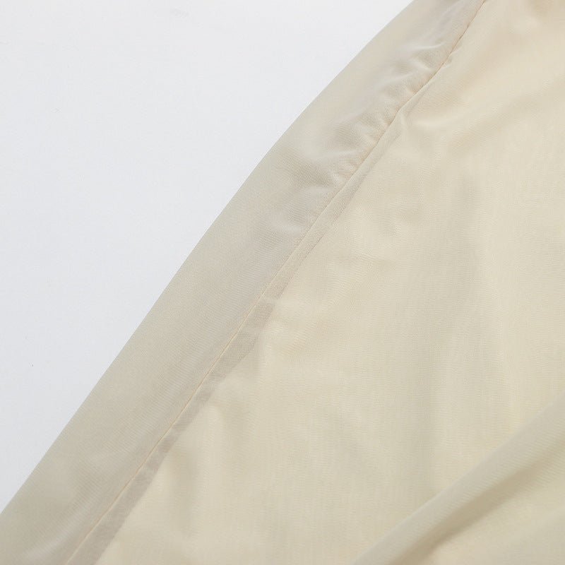 Close-up of pearl button fastening at back neckline