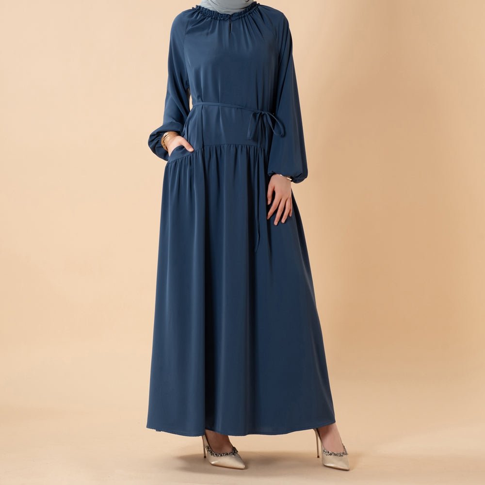 Front view of ruffle neckline detail on lightweight pleated abaya