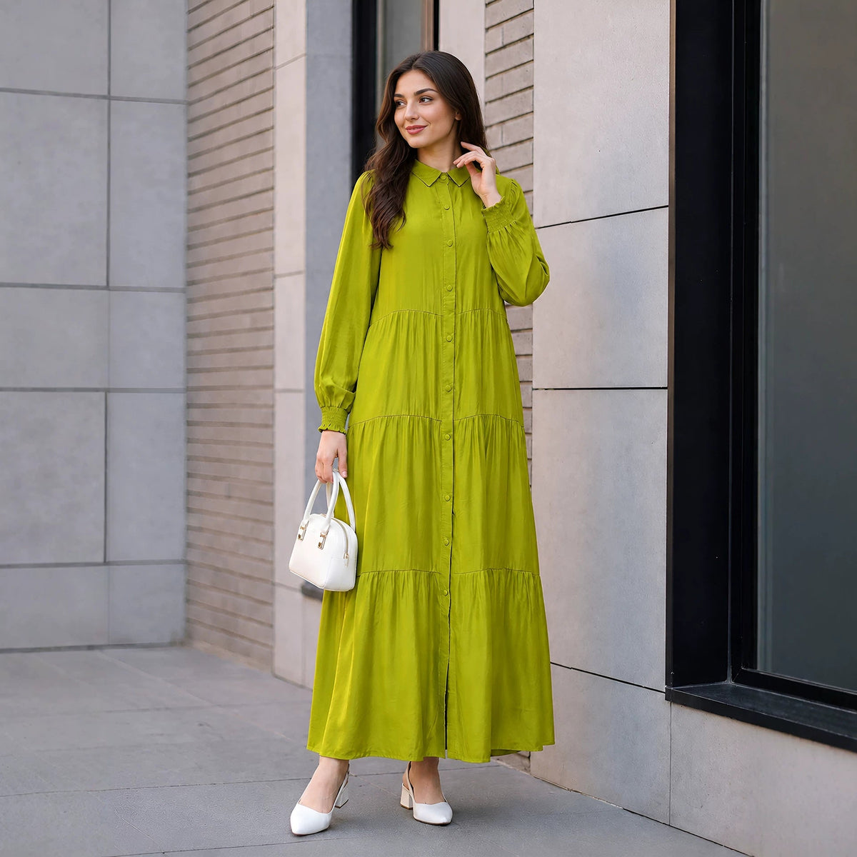 Front view of three-tier gathered skirt on button-down modest dress