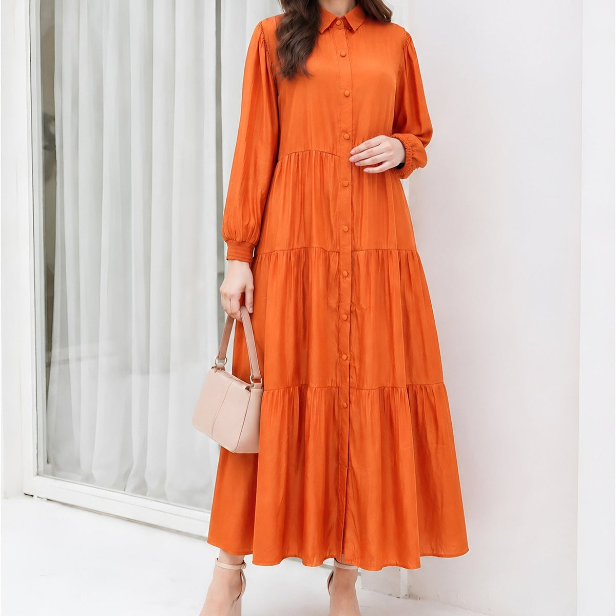 Flowing tiered skirt movement on floor-length modest dress