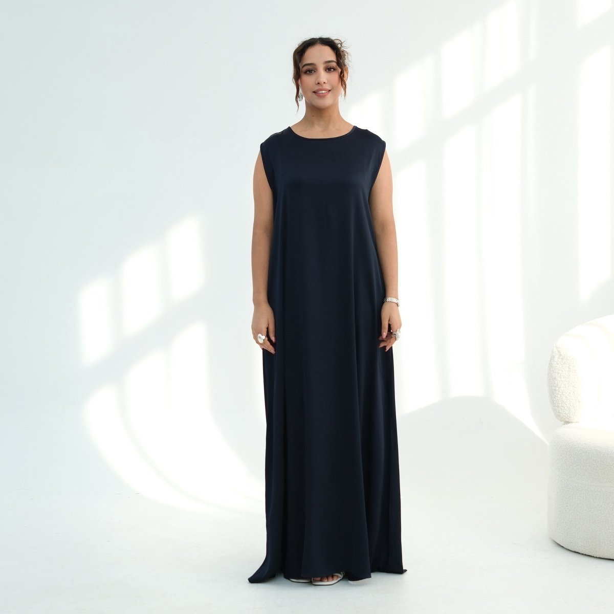 Back view of sleeveless kaftan maxi dress showing full-length modest coverage