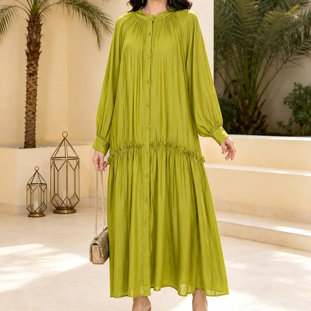 Three-quarter view of everyday abaya in tie-waist silhouette