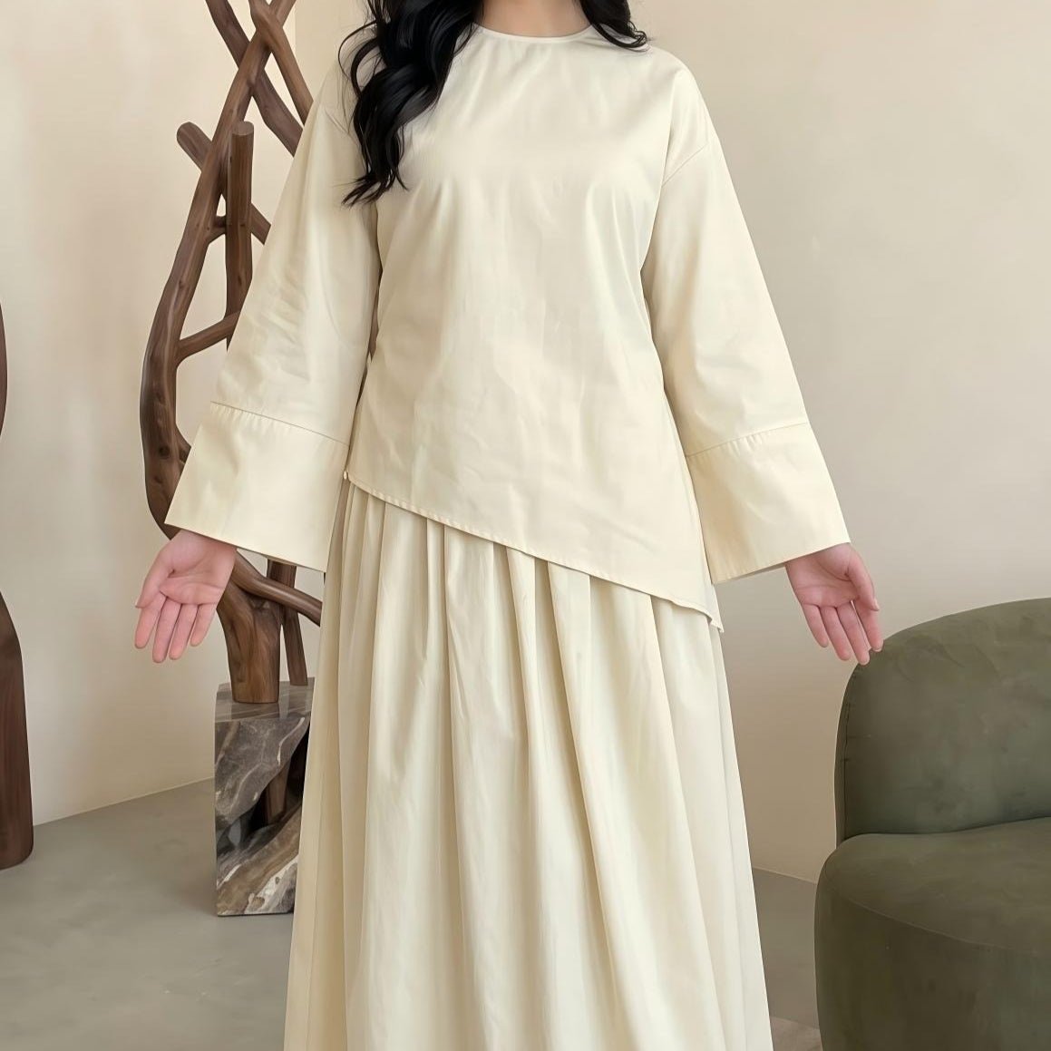 Side profile of solid colour maxi skirt showing full-length coverage